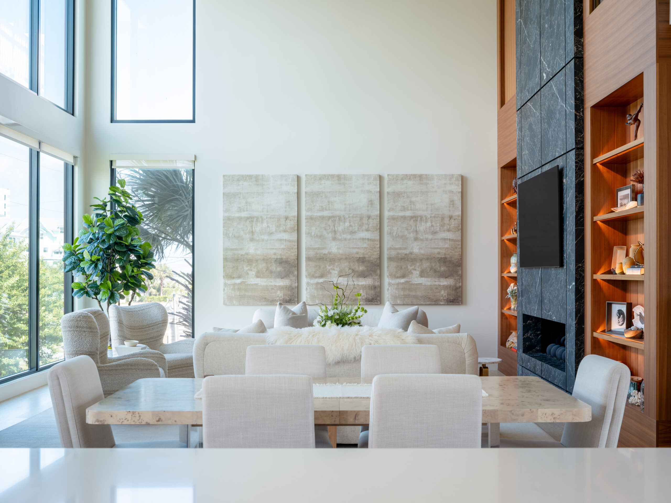 View across the kitchen island of a modern, open-concept coastal vibes home.