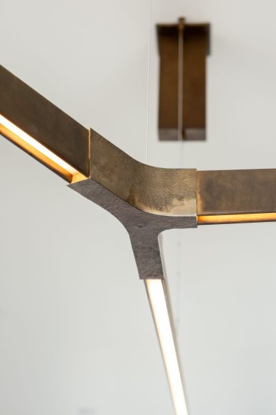 Modern light fixture with exposed metals